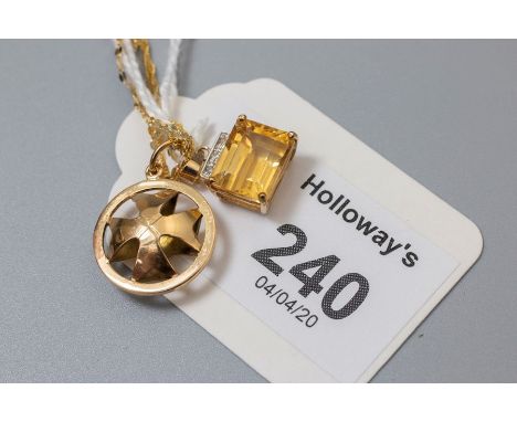 A citrine and diamond pendant,  the single  stone step cut rectangular citrine with three stone diamond surmount, marked '375