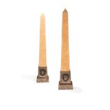 A pair of plywood and cast iron obelisk standard lamps, the plinths probably early 20th century