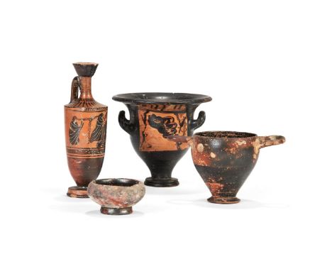 Four Greek pottery vessels, including an Attic black-glazed lekythos, the decoration highlighted with white and purple slip w