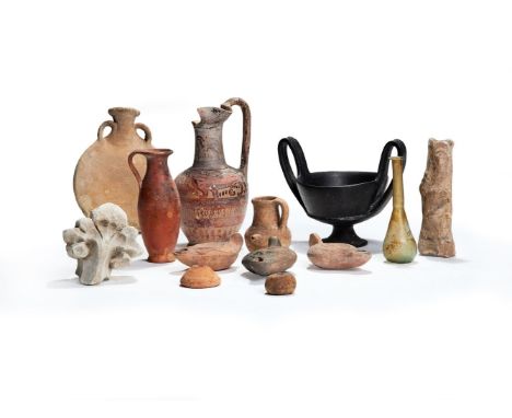 A miscellaneous group of antiquities and later items, including a handled vessel with worn glaze, the shoulder decorated with