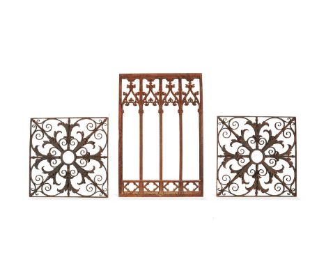 A pair of French or English wrought iron grille or balcony panels, 19th century, each openwork square field with central aper