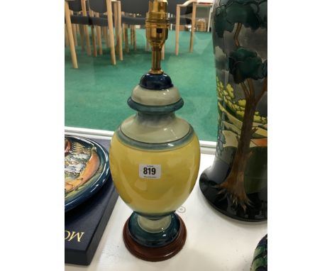 A William Moorcroft large table lamp decorated in a graduated yellow and blue glaze, circa 1930 on wooden base with fittings 