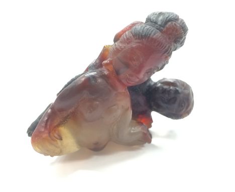 An erotic Netsuke study modelled as two naked male and female figures.