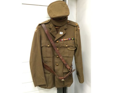 A WWII green cloth jacket with the Royal Army Medical Corps buttons and logo, Sam Brown and pips.