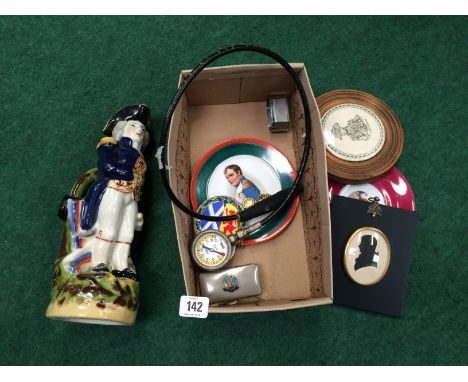 A framed Lord Nelson china pot lid, two Napoleon Bonaparte decorated saucers and a reproduction china Nelson jug and other it
