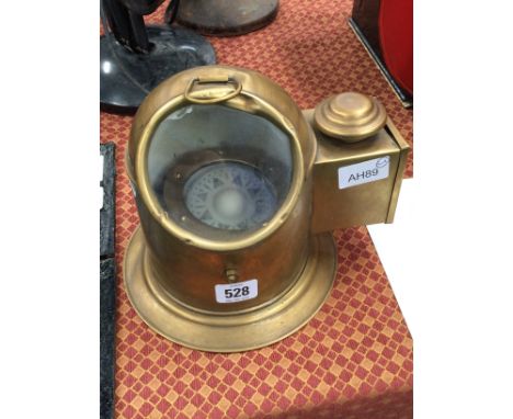 A reproduction binnacle compass in brass case.