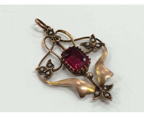 A 9 carat gold art nouveau synthetic ruby pendant