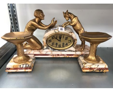 A French 1930's marble mantle clock with side vases depicting a young girl and a goat.