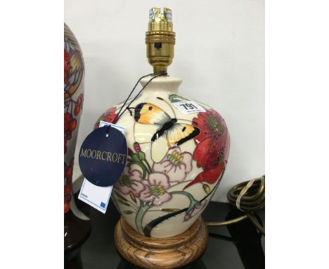 A FAMILY THROUGH FLOWERS: A Moorcroft Pottery table lamp, by Emma Bossons with Moorcroft silk shade, circa 2011 (26cm high).