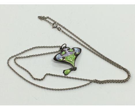 An Art Nouveau Smith & Ewen style silver and enamel pendent.