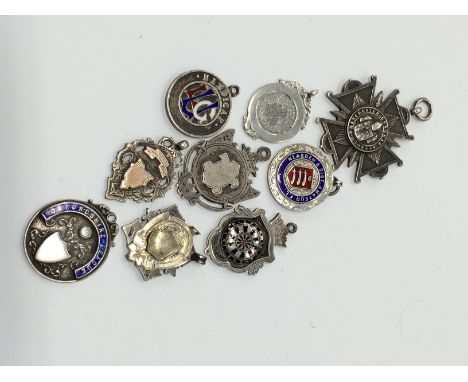 A large collection of watch chain fobs in silver and enamel (R13).