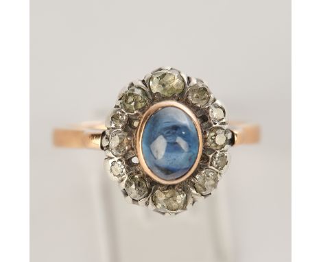 Ring, 1920er Jahre, wohl RG/Platin, Saphircabochon ca. 0.60 ct.,12 Altschliffdiamanten, ca. 4.77 g, RM 55.5