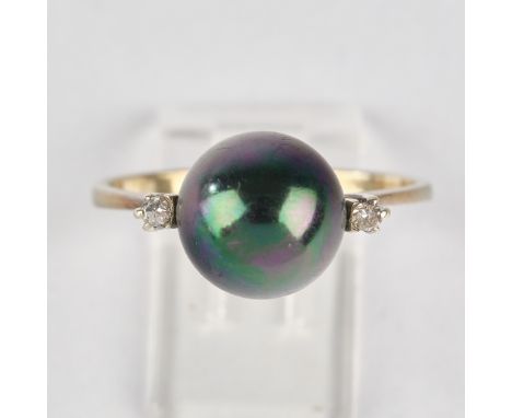 Ring, WG 750, dunkle Tahiti-Zuchtperle ø 9 mm, 2 Besatzbrillanten ca. 0.04 ct., ca. 3.05 g, RM 54