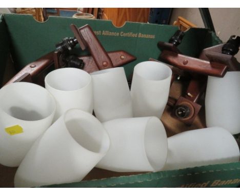 A tray of retro wall light fittings and shades