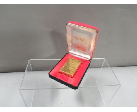 A vintage 'Myon, King O Flam' gold plated cigarette lighter in original fitted box