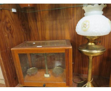 Cased weighing scales together with a brass lamp (2)