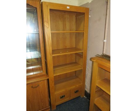 A modern open light oak bookcase with two drawers below H  180 cm W 75 cm