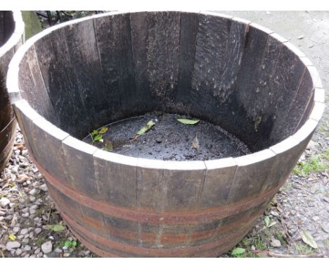 A very large half barrel oak garden planter