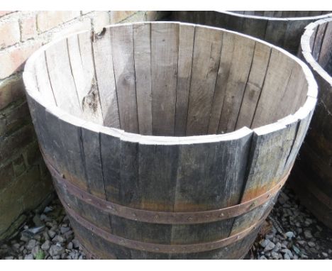 A very large half barrel oak garden planter