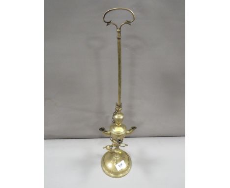 An antique brass Lucerne standing lamp