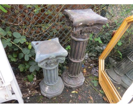 Two plastic planter plinths