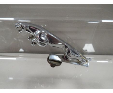 A vintage Jaguar car mascot