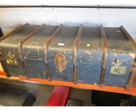 A vintage steamer travel trunk with 6 wooden ribs