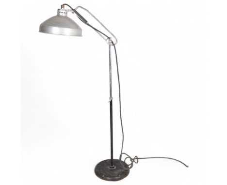 A 1950s' design dentist lamp with aluminium shade and iron/chrome adjustable stem, height 150cm . Condition Report: Some corr