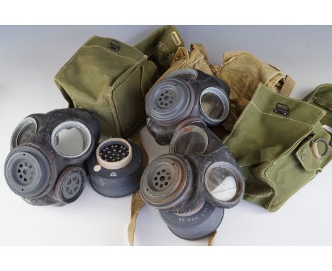 Three Second World War British army lightweight respirators / gas masks