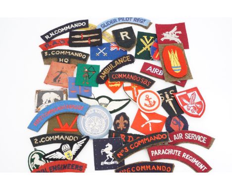 A quantity of British army cloth badges etc