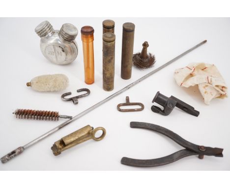 A quantity of military gun parts and tools including oil bottles, a Bren machine gun fouling tool etc