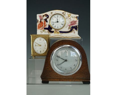 A Mason's Mandalay clock, a small mid-20th Century Smith's oak cased clock and a 1960s Swiza alarm clock