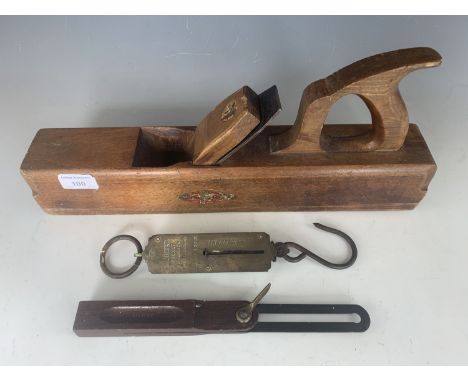Tools comprising a Marples jack plane, Stanley rosewood sliding bevel gauge, and a Salter spring balance