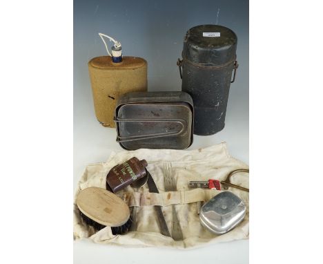 A large collection of Second World War British army personal kit together with an army Thermos flask