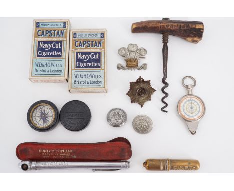 Sundry collectors' items including cap badges, a Merrit pocket compass, Victorian corkscrew, Dunlop "Popular" tyre pressure g