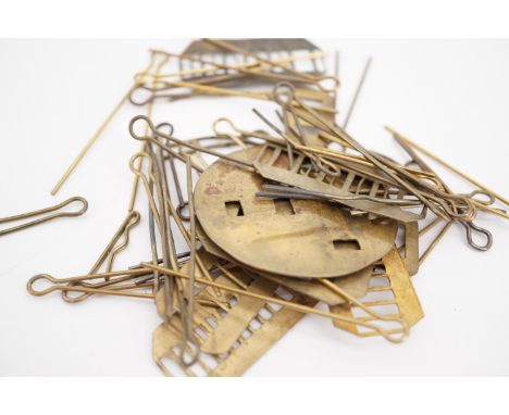 A quantity of British army badge backing plates and pins