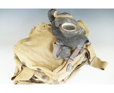 A Second World War British army gas mask and several General Service respirator haversacks