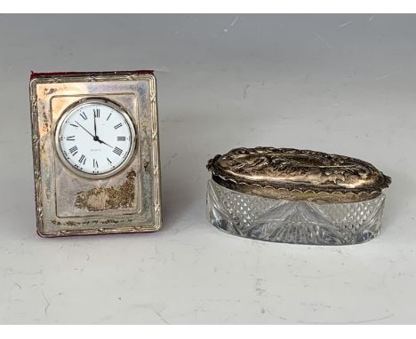 A silver-faced boudoir clock and a silver-lidded cut glass dressing table box