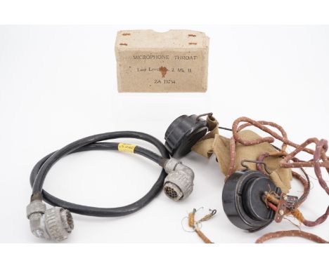 A set of Second World War British army headphones, a radio connector and throat microphone box