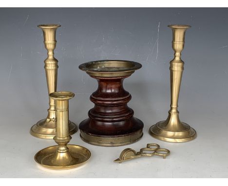 A pair of Georgian style brass candlesticks, one other slide eject example, candle snuffers and a brass-mounted turned wooden