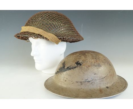Two Second World War British army helmets (a/f)