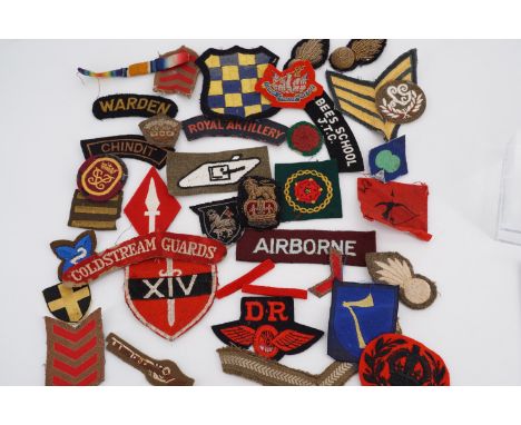 A quantity of British army cloth badges etc