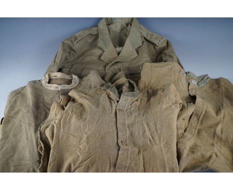 A Second World War army officer's khaki drill tunic and several shirts