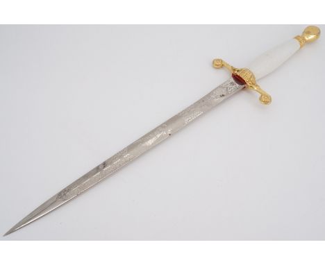 A Wilkinson Sword dagger, the blade etched in depiction of a cricketer