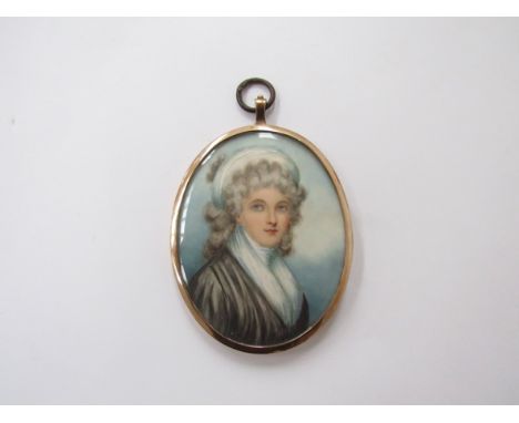 An early 19th Century oval miniature on ivory, portrait of a woman. Unsigned. Set in a yellow metal frame. 6.7cm x 5.3cm