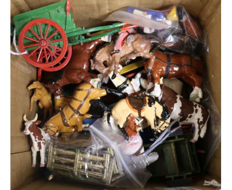 A collection of Britains and other die-cast farm models, including hay wagons, carts, plough share, horse trough, hay stacks,