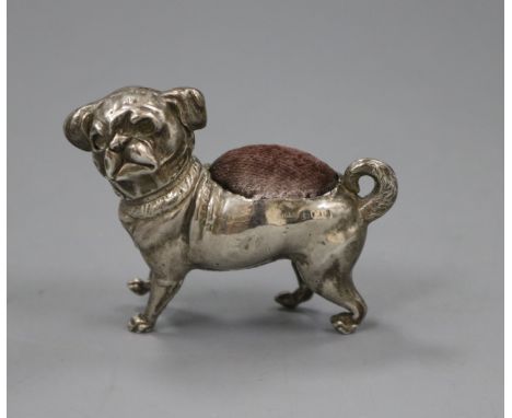 An Edwardian novelty silver pin cushion, modelled as a free standing pug dog, Crisford &amp; Norris, Birmingham, 1906, length