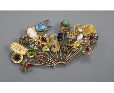 An early 20th century mixed metal including gold and gem set fan shaped brooch, modelled from assorted stick pins, 97mm.