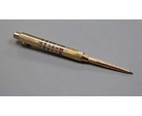 A Sampson Mordan &amp; Co yellow metal and enamel cased calendar pencil.