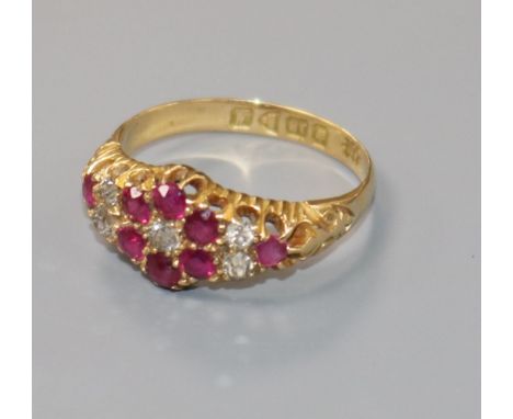 A George V 18ct gold, ruby and diamond cluster ring, size O.